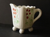 Sowerby Opal glass, flowers picked out in red, mustard and green enamel
